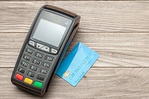 Credit Card Machine Processing 300x200 1 Payment Processing Credit card machine on a table