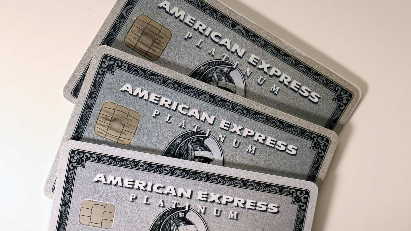 three american express amex platinum cards on a white table 155215735 amex virtual card