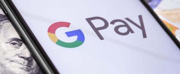 money dollars and smartphone with google pay logo on the screen 142599037 825x340 1