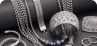 Elegant jewelry display featuring necklaces, bracelets, and rings with premium gemstone accents.