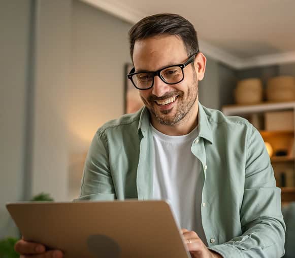 Professional man using a tablet, representing merchant services and payment solutions.