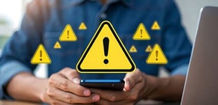 Warning alert on smartphone, cybersecurity risk, digital security, data protection, urgent threat.