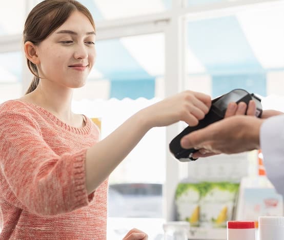 Contactless payment transaction at retail store.