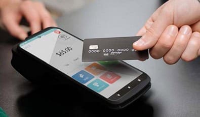 Mobile credit card processing with POS device for seamless payment solutions.