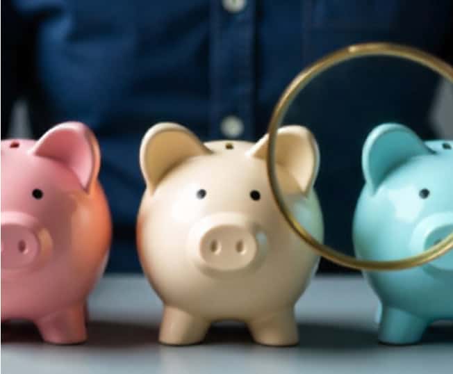 Small piggy banks with coins, representing savings and financial management.