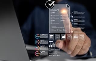 Mobile payment processing interface with invoice and data analytics on screen.