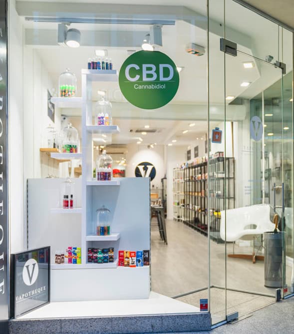 CBD cannabidiol product store with glass entrance and modern interior.