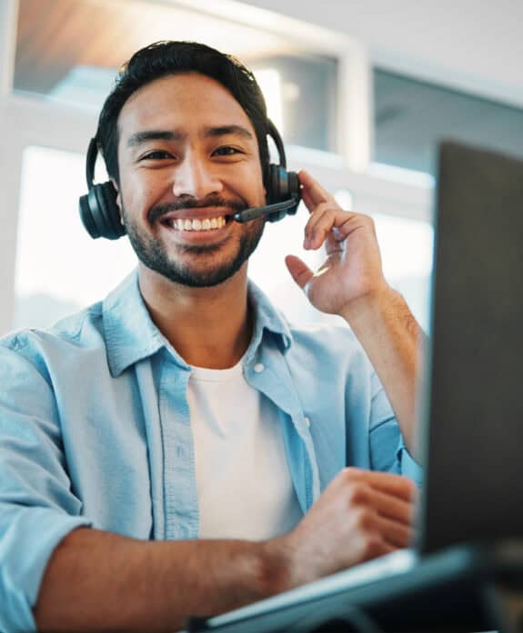 Reliable customer support agent with headset at modern office.