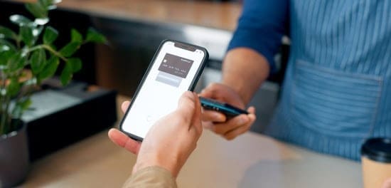 Mobile payment processing with a smartphone and card reader for seamless merchant transactions.