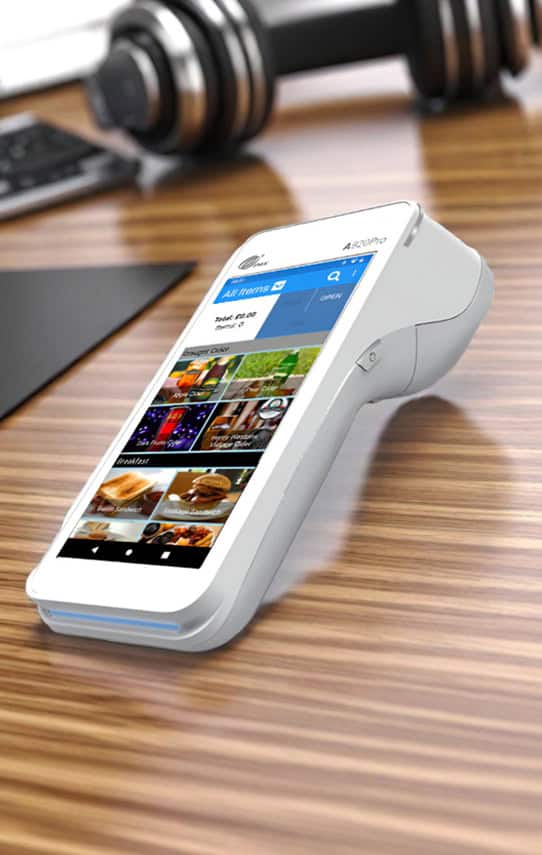 Contactless payment device on wooden table for Host Merchant Services solutions.