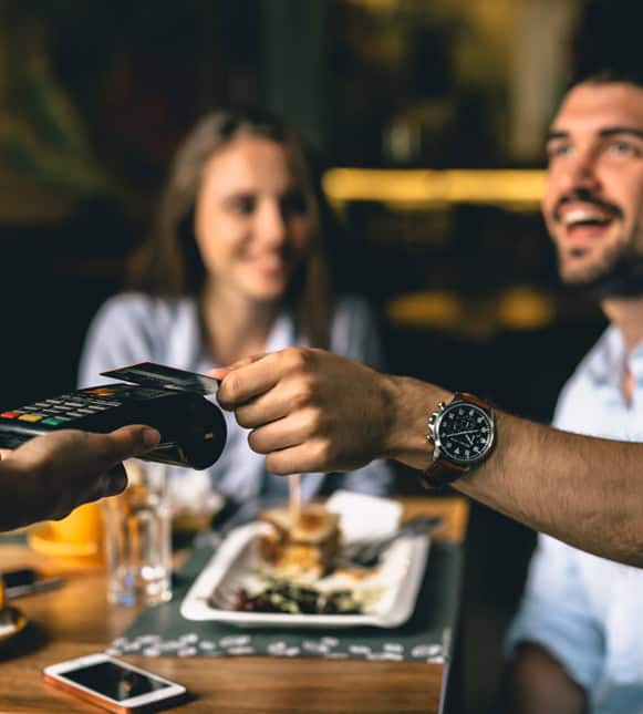 Contactless payment transaction at restaurant with Host Merchant Services.