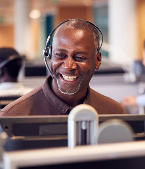 Responsive customer support agent with headset ensuring excellent service at Host Merchant Services.