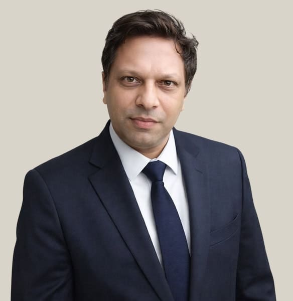 Business professional in formal suit representing Host Merchant Services, offering payment processing solutions for businesses.