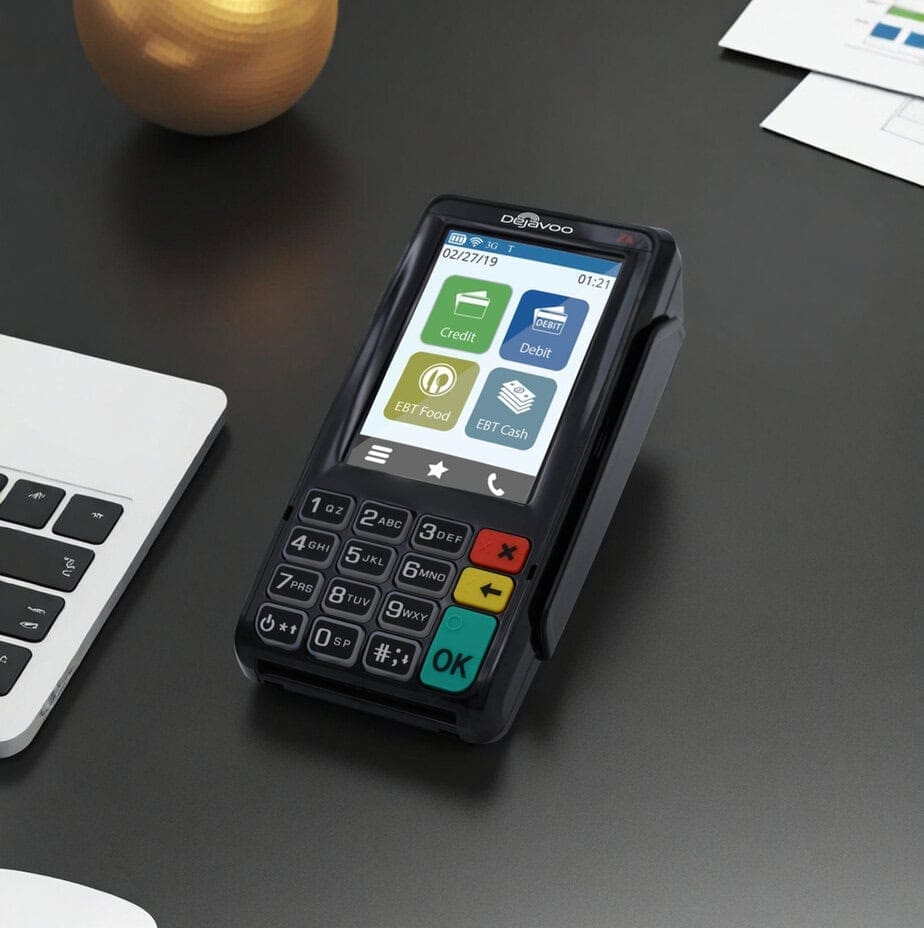 Contactless payment terminal for Host Merchant Services on a dark desk.