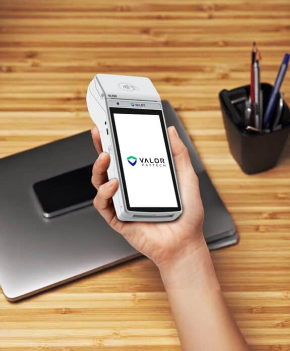 Mobile payment device with Valor PayTech logo for Host Merchant Services.