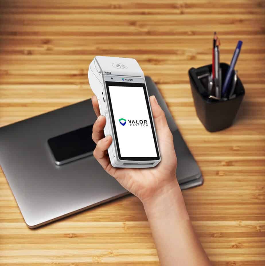 Mobile payment device with Valor PayTech logo for Host Merchant Services.