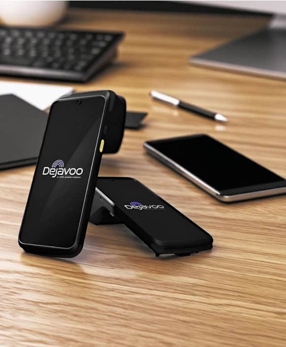 Mobile payment device by Host Merchant Services on a wooden desk with office supplies.